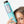 Cargar imagen en el visor de la galería, Cara de una chica escondida detrás de botella de COLOR BREEZE SHAMPOO

